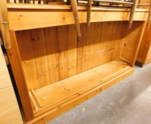 A pine open bookcase, 93cm high, 151cm wide, 31cm deep.