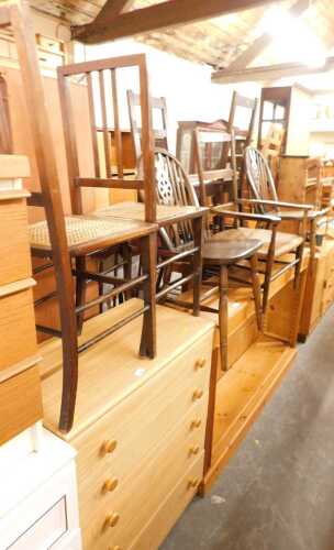 A group of furniture, to include two wheelback dining chairs, a five drawer chest, a ladderback...