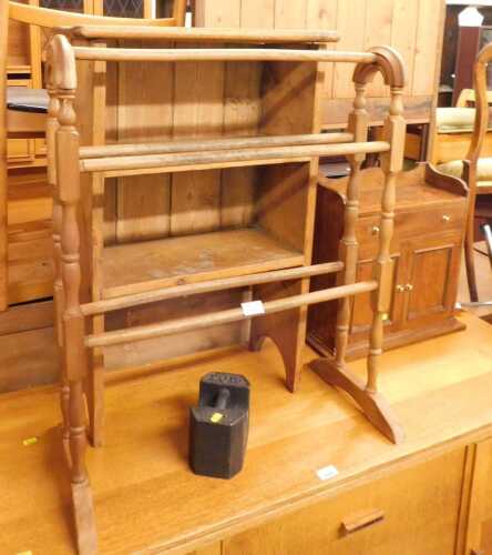 A group of furniture, comprising a towel rail, a pine bookcase of small proportion, hanging...