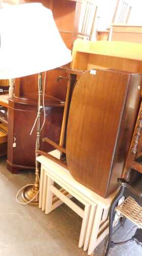 A group of furniture, to include a drop leaf table, nest of tables, open bookcase, standard lamp,...