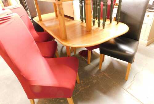 A teak extending dining table, raised on cylindrical legs, 74cm high, the top 100cm x 191cm,...