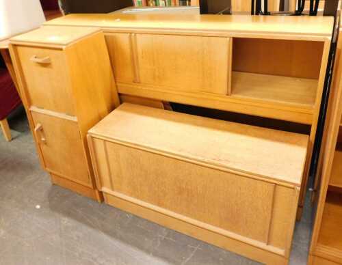 A group of G-Plan oak furniture, comprising an ottoman, a Brandon range cabinet with a fall...