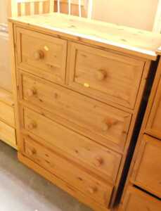 A pine chest, of two short over three long drawers, raised on a plinth base, 101cm high, 75cm...