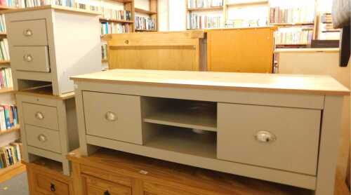 A television cabinet, with wood veneered top, raised on a pale grey painted base, with two...