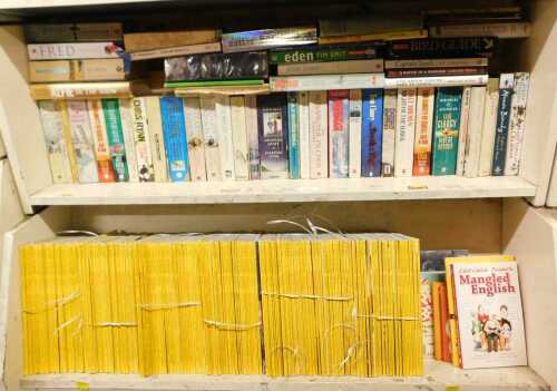 Various editions of The National Geographic, together with paperback fiction, authors to include...