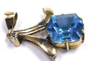 A topaz and diamond pendant, in a floral and bud design, in yellow metal, stamped 585, 2.0g. - 2