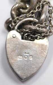 A silver curb link bracelet, on a heart shaped padlock clasp, 0.89oz, together with assorted... - 6