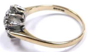 A 9ct gold and diamond flower head ring, of three tier form, in a claw setting, approx 0.5ct,... - 2