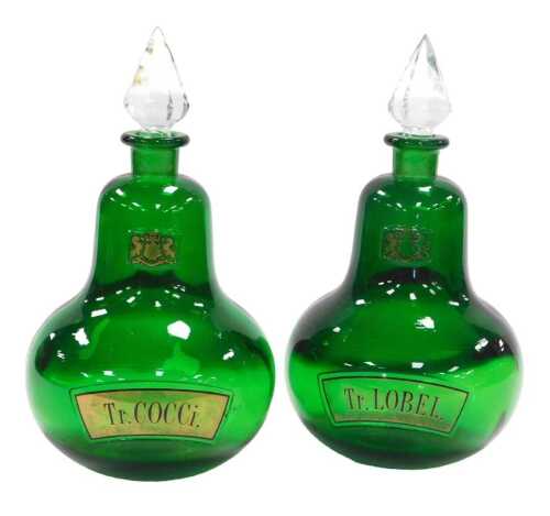 A pair of mid century Royal Pharmaceutical Society glass apothecary bottles, and clear glass...
