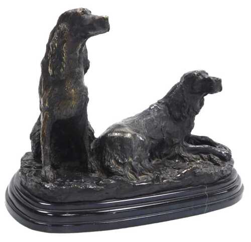 After Jules Moignez. Bronze figure group of a pair of cocker spaniels, raised on a naturalistic...