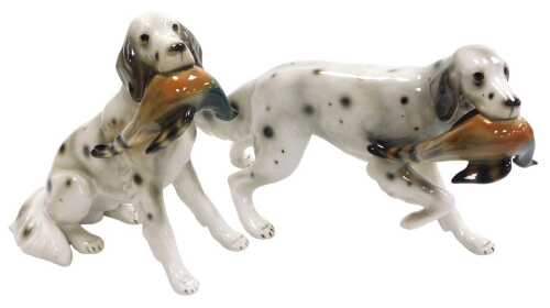 A pair of 20thC Keramos porcelain figures of English setters, one modelled seated, the other...