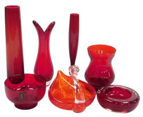 A group of Whitefriars ruby glass, comprising a swan dish, an ashtray, four vases, and a candle...