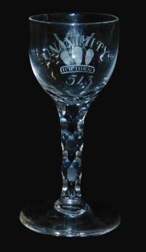 A late 18thC Masonic wine glass, the ovoid bowl engraved with Unanimity, above Prince of Wales...