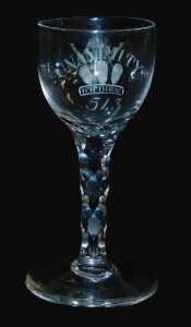 A late 18thC Masonic wine glass, the ovoid bowl engraved with Unanimity, above Prince of Wales...