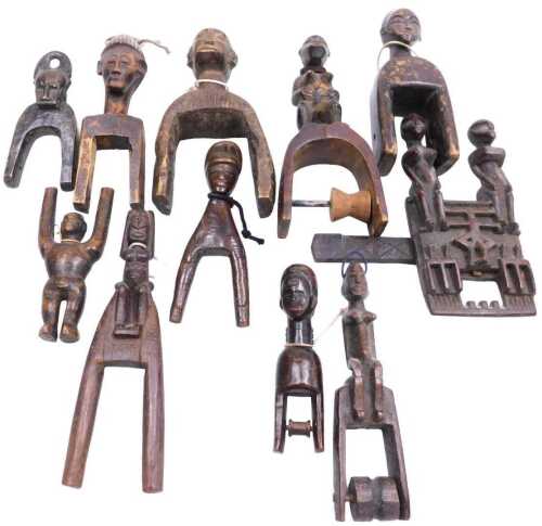 A Mali carved wood figure of a granary door lock, together with C&ouml;te d'Ivoire figural heddle...