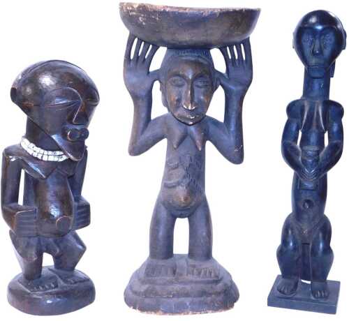 A Congolese Songye figure, with a bone necklace, 44cm high, together with a Luba fertility stool,...