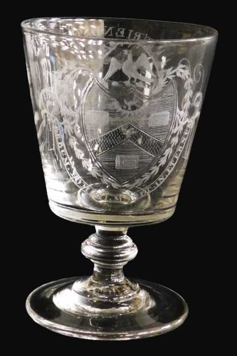 An early 19thC Georgian glass rummer, the bucket shaped bowl engraved with an oval cartouche of...