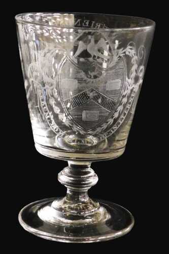 An early 19thC Georgian glass rummer, the bucket shaped bowl engraved with an oval cartouche of...