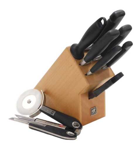 A seven piece kitchen set by J A Henckels Zwilling, in a knife block, together with peelers and...