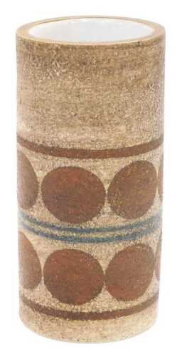 A Troika pottery vase, of cylindrical form, decorated with bands of repeating brown circles...