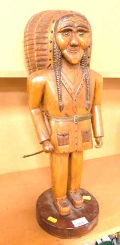 A carved hardwood Native American figure, 55cm high.