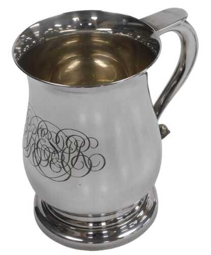 An Elizabeth II silver tankard, of baluster form, monogram engraved, London 1975, 10.66oz.