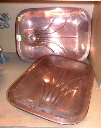 Two copper tree and well meat platters, 48cm x 34cm.