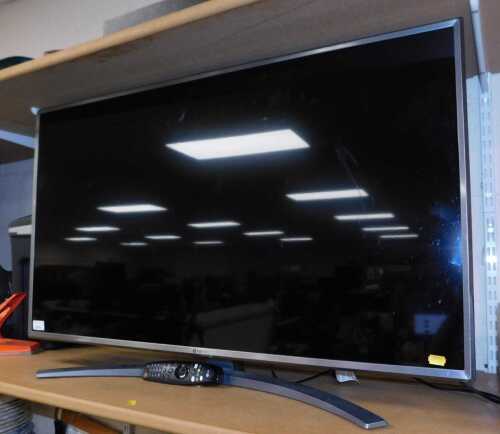 A LG 42 inch flatscreen television, model 43UM7600PLB, together with lead and remote.