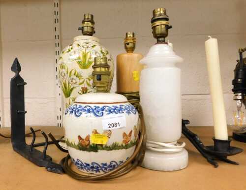 Assorted lamps, comprising a Brixton pottery lamp base decorated with chickens, and stone, wood...