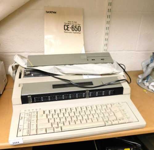 A Brother electric typewriter, model no. CE-650, together with an instruction manual.