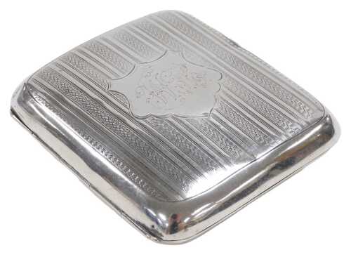 An Edward VII silver cigarette case, with engine turned decoration, shield reserve, stipple...
