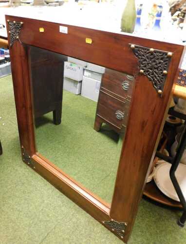 A hardwood mirror, with inlaid floral ironwork, with a bevelled glass plate, 90.5cm high, 80cm...