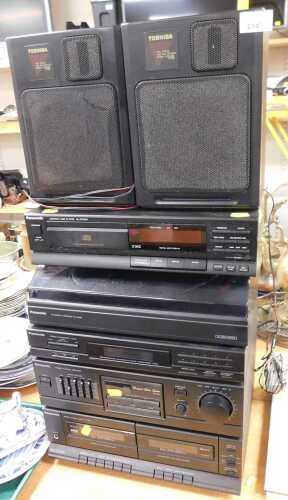 A Panasonic music system, comprising a compact disc player, model SL-PJ325A, an automatic...