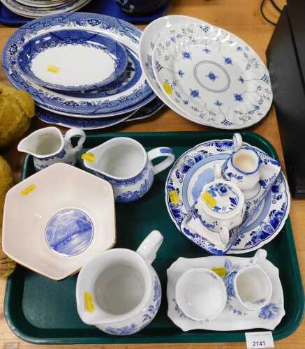Blue and white ceramics, including a Delft blue hand painted plate, depicting a windmill stating...