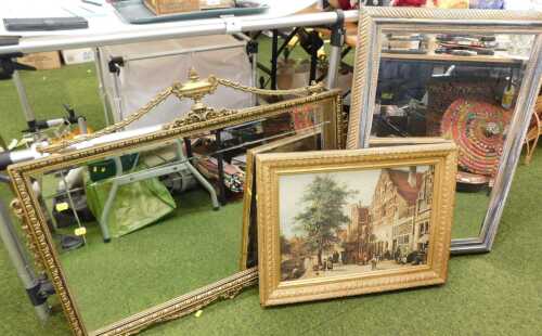A Neo classical style giltwood wall mirror featuring an urn finial and scrollwork detailing,...