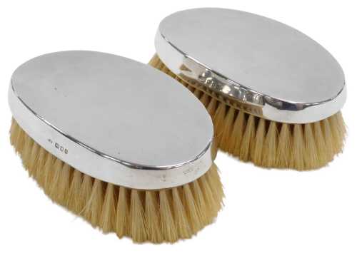 A pair of plain silver backed gentleman's hair brushes, Collett and Anderson, London 1964.