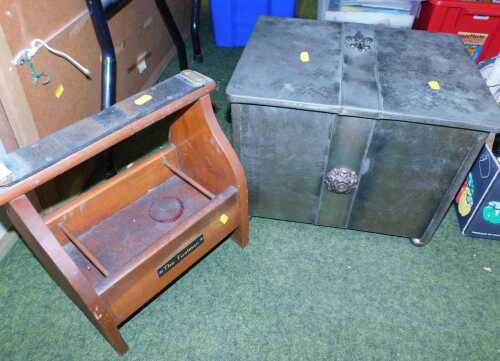 A mid 20thC stained pine shoe shine valet, with a rubber footrest, with a plaque to the front...