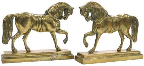 A pair of 19thC brass hearth ornaments, each cast in the form of a horse, on a stepped...