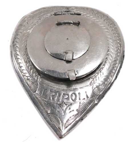 A WWII Libyan heart shaped compact, engraved to the front with a wreath and "Tripoli", verso a...