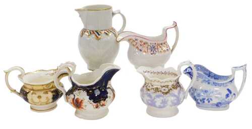 A group of 19thC pottery and porcelain jugs, including a Coalport mask head jug, a Gaudy Welsh...
