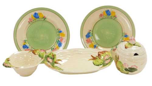 A Clarice Cliff Newport pottery preserve pot and cover, relief decorated with water lilies,...