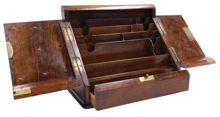 A Victorian walnut and figured walnut slope topped writing box, the hinged doors enclosing a...