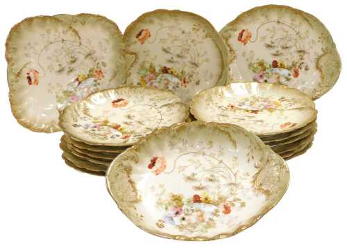 A late 19thC M Redon Limoges porcelain part dessert service, decorated with flowers, and a...