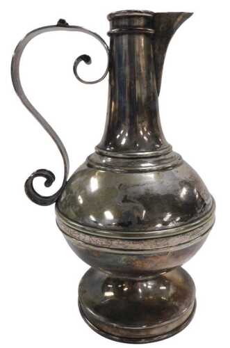 A late 19thC silver plated communion flagon, hinged lid lacking, of baluster form, with a scroll...