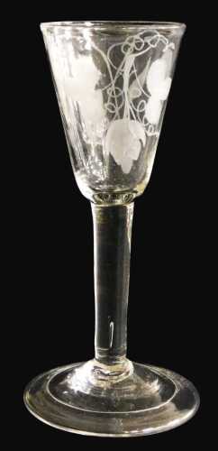 A late 18thC Georgian ale glass, the tapering bowl engraved with hops and barley, raised on a...