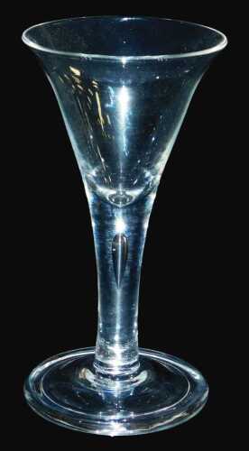 A late 18thC Georgian wine glass, with a drawn trumpet shaped bowl over a plain stem with an...