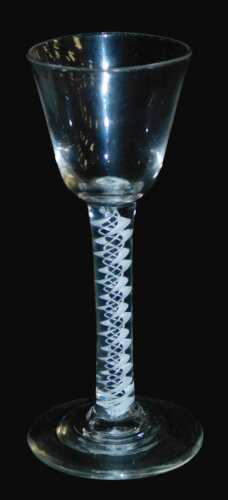 A late 18thC Georgian cordial glass, with a funnel shaped bowl, raised on a double opaque white...