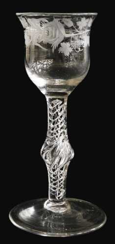A late 18thC cordial glass, possibly Jacobite, engraved with vines, barley, a rose, and a...