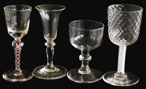 A late 18thC Georgian cordial glass, with a trumpet shaped bowl, over a single knopped stem and...