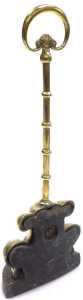 An early Victorian brass and iron doorstop, cast with scrolls, with a loop handle, 28cm high. - 2